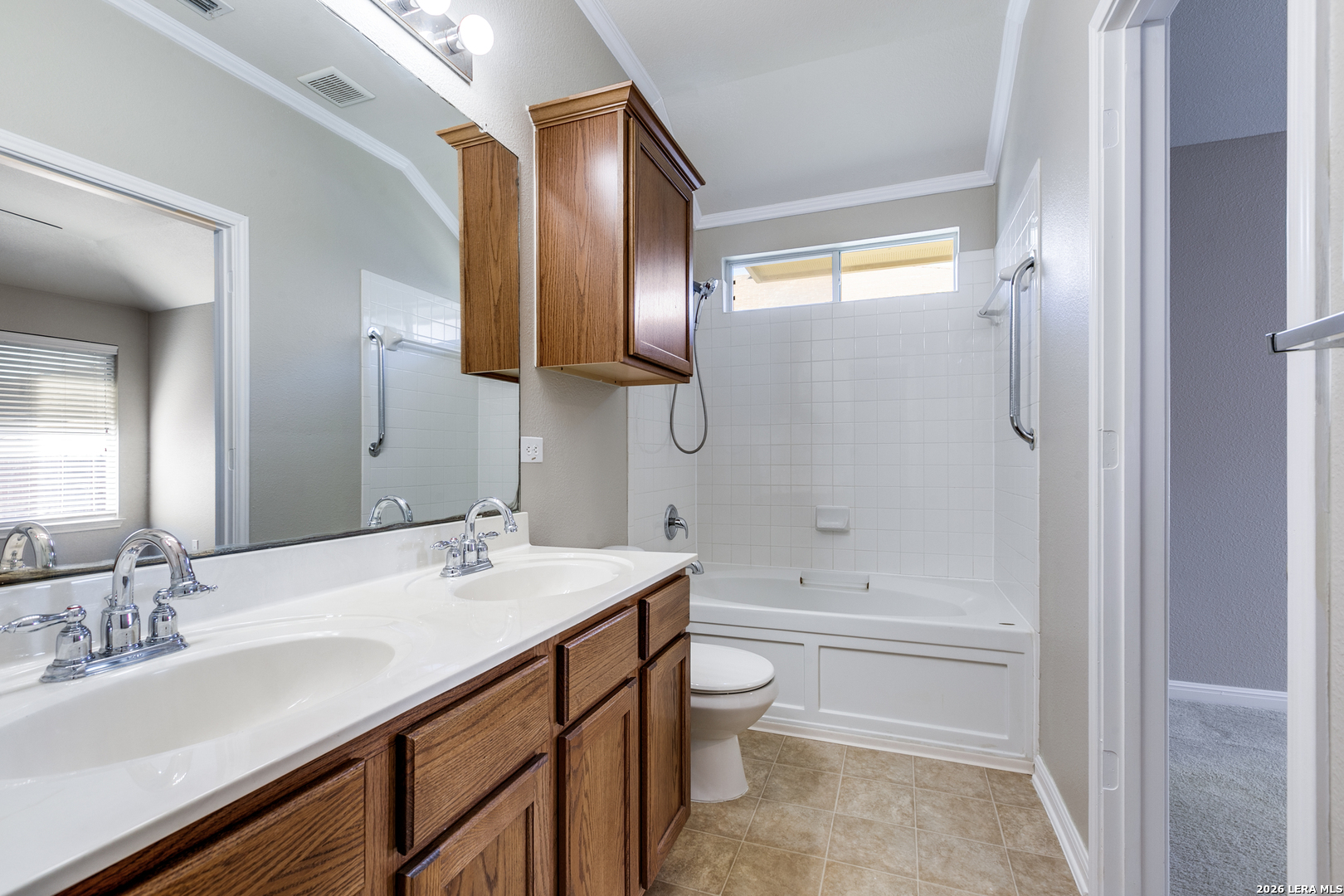 6822 Freedom Ridge San Antonio, TX 78242 - Photo 17 of 25 a bathroom with a bathtub shower sink and toilet
