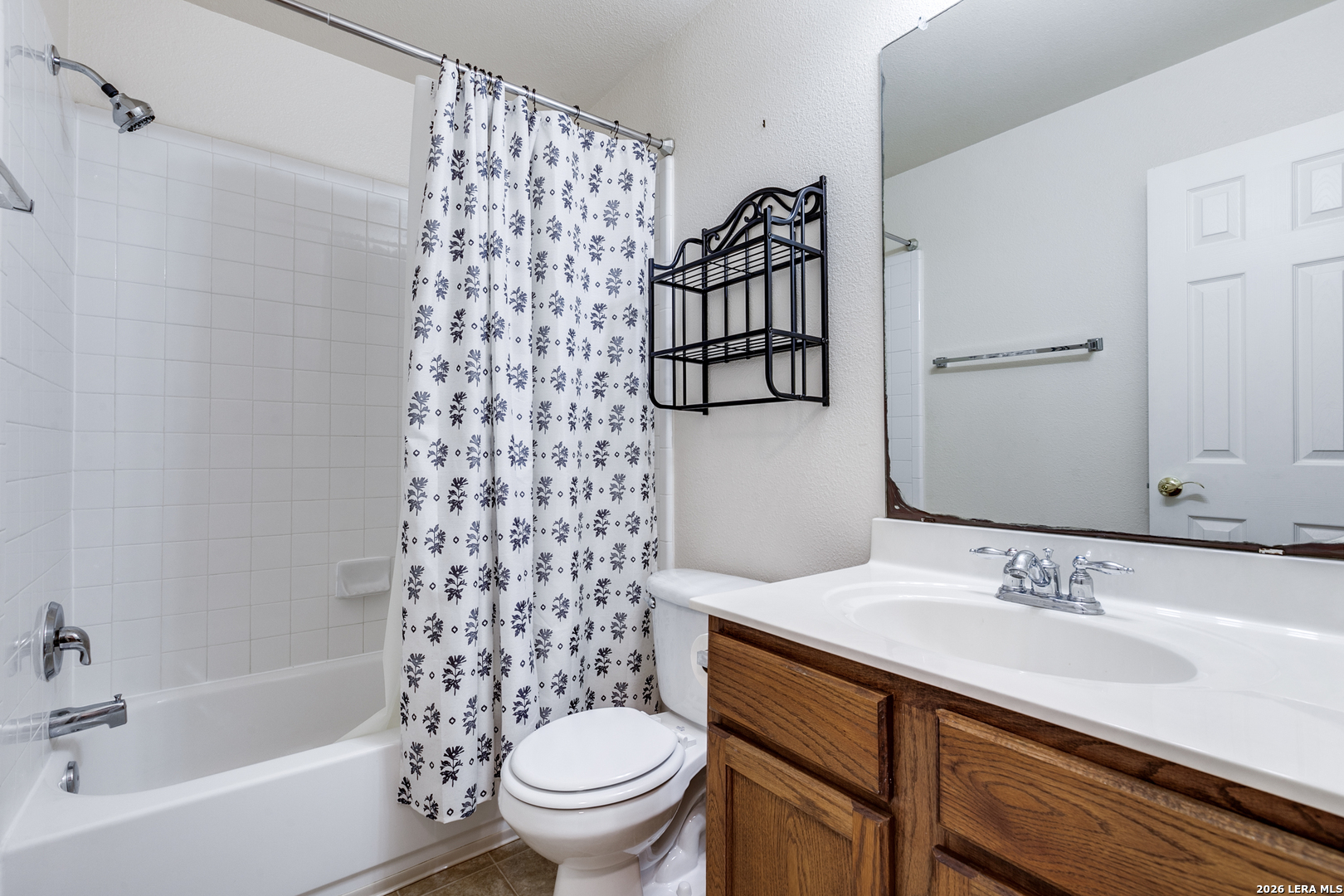 6822 Freedom Ridge San Antonio, TX 78242 - Photo 20 of 25 a bathroom with a sink toilet and shower