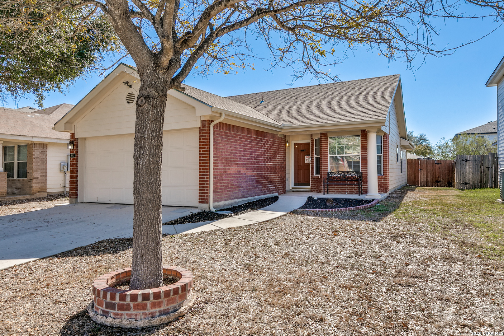 6822 Freedom Ridge San Antonio, TX 78242 - Photo 2 of 25 a front view of a house with a yard