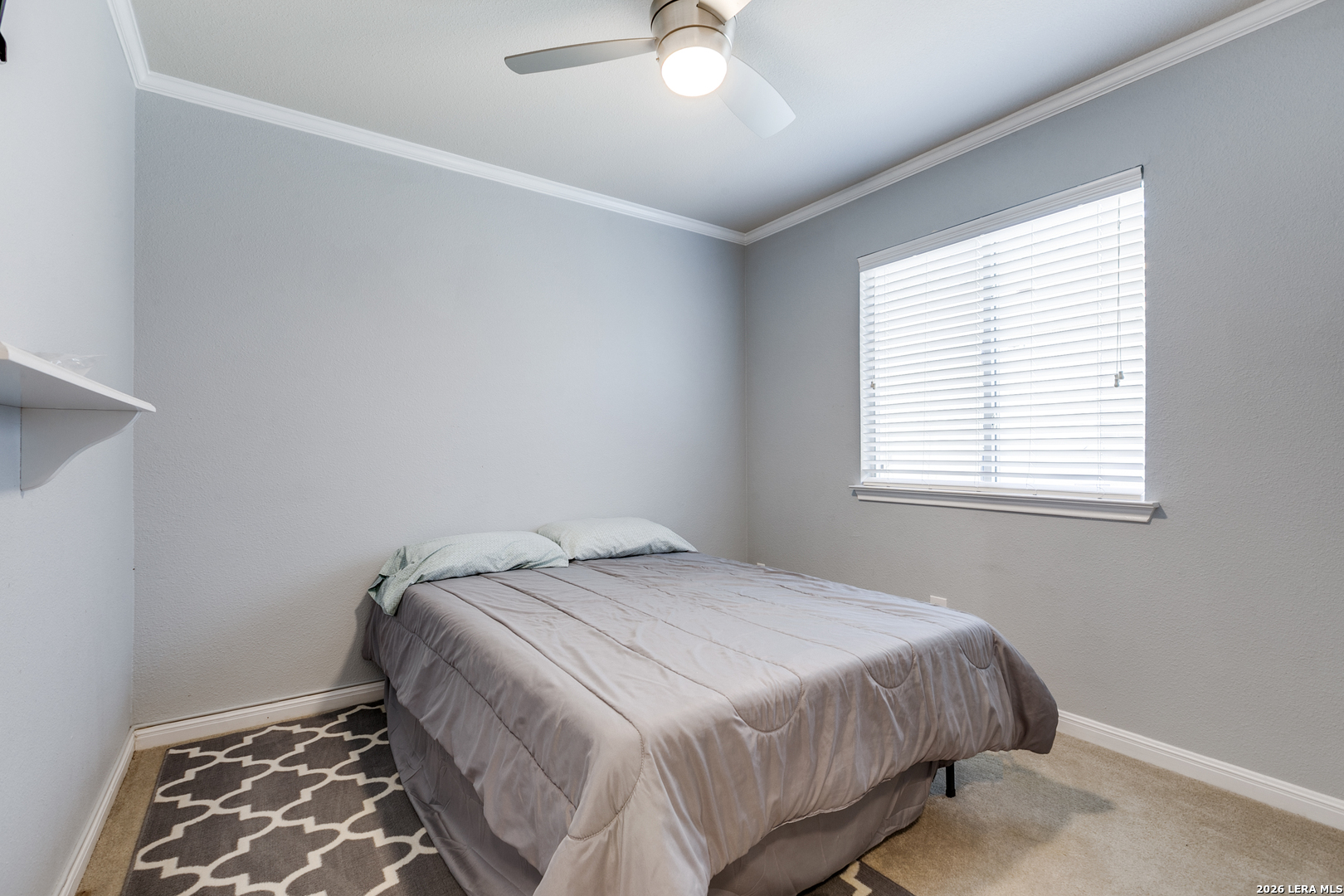 6822 Freedom Ridge San Antonio, TX 78242 - Photo 21 of 25 a bedroom with a bed and a window