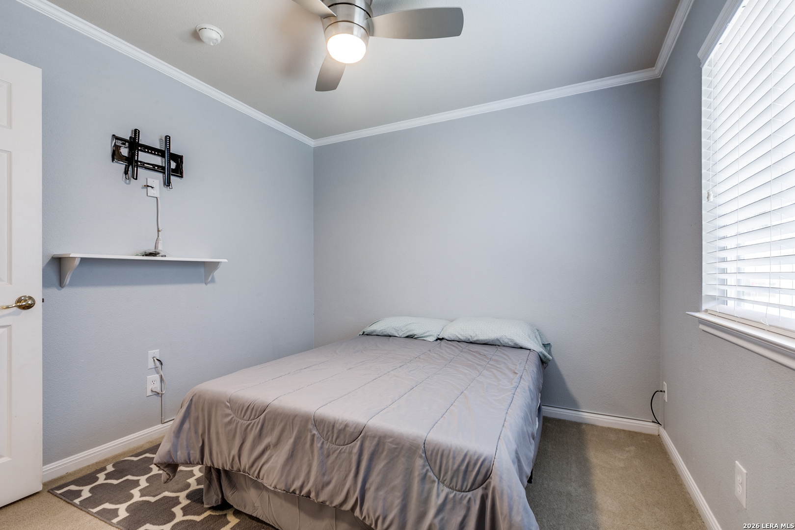 6822 Freedom Ridge San Antonio, TX 78242 - Photo 22 of 25 a bedroom with a bed and a window