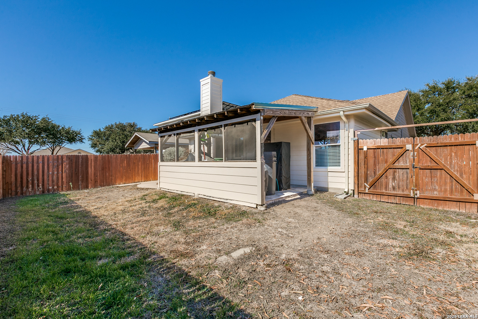 6822 Freedom Ridge San Antonio, TX 78242 - Photo 24 of 25 a view of a house with a yard and wooden fence