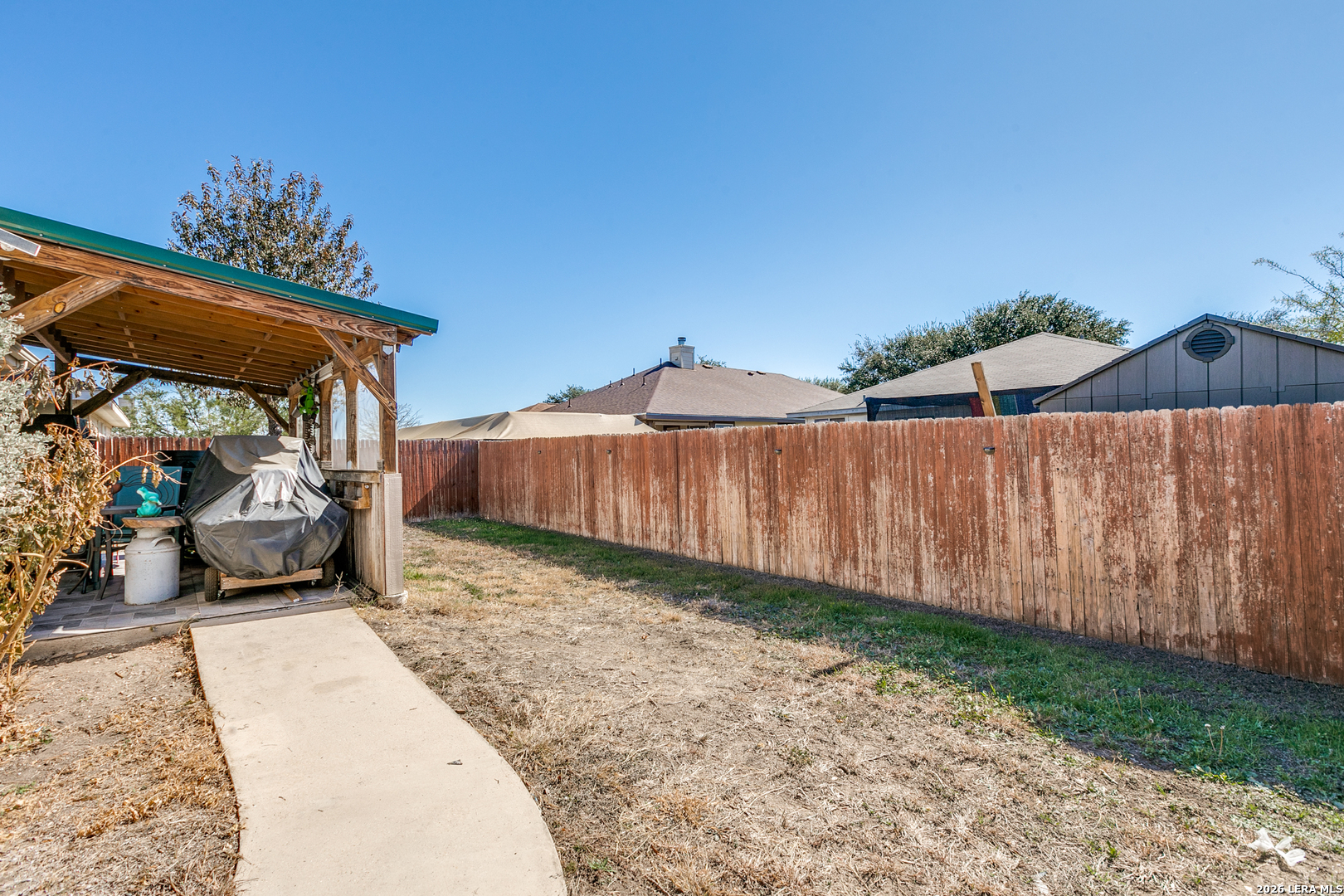 6822 Freedom Ridge San Antonio, TX 78242 - Photo 25 of 25 a view of a backyard with sitting area