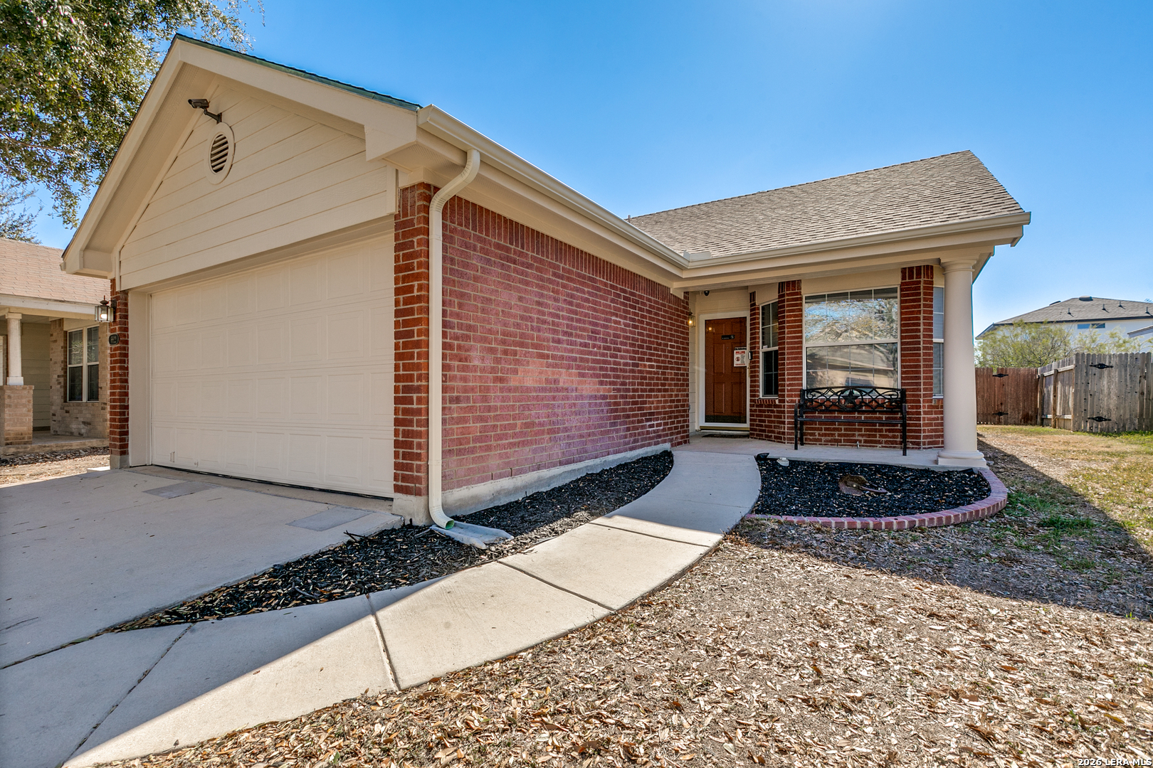 6822 Freedom Ridge San Antonio, TX 78242 - Photo 3 of 25 a front view of a house with garden