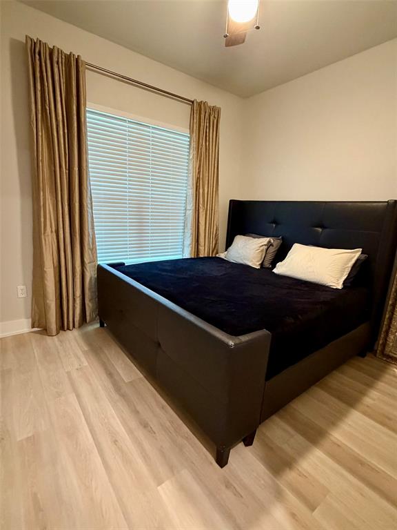 151 Gopher Road Weatherford, TX 76088 - Photo 16 of 22 a bed sitting in a bedroom next to a window