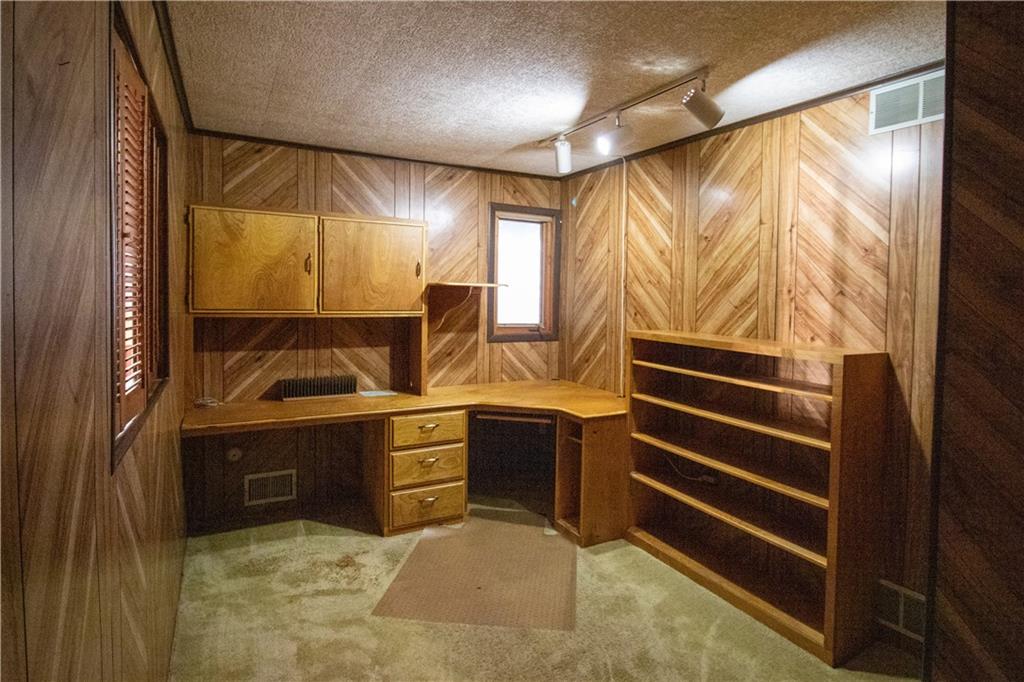 3380 Ridgway Street Pittsburgh, PA 15213 - Photo 17 of 25 Upper level office. Master suite is located to the right; stairs to main level on the left. Shuttered window on the left opens to reveal an aerial view of the dining room/living room area.