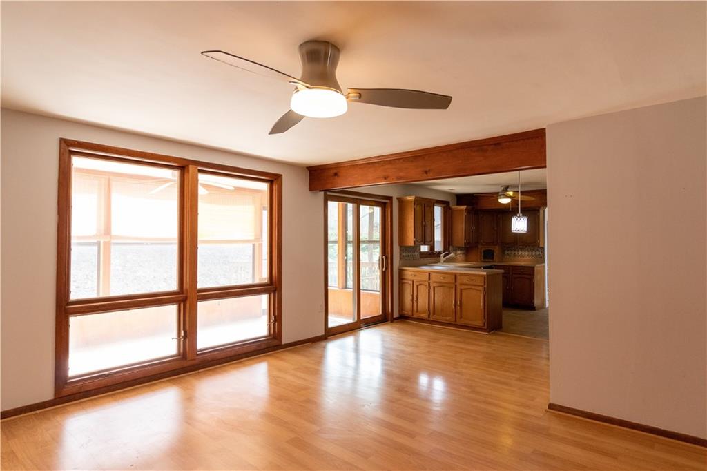 3380 Ridgway Street Pittsburgh, PA 15213 - Photo 4 of 25 View of the kitchen and sunroom (ie. enclosed back porch) from center of the family room. The backyard is accessible through the sunroom.