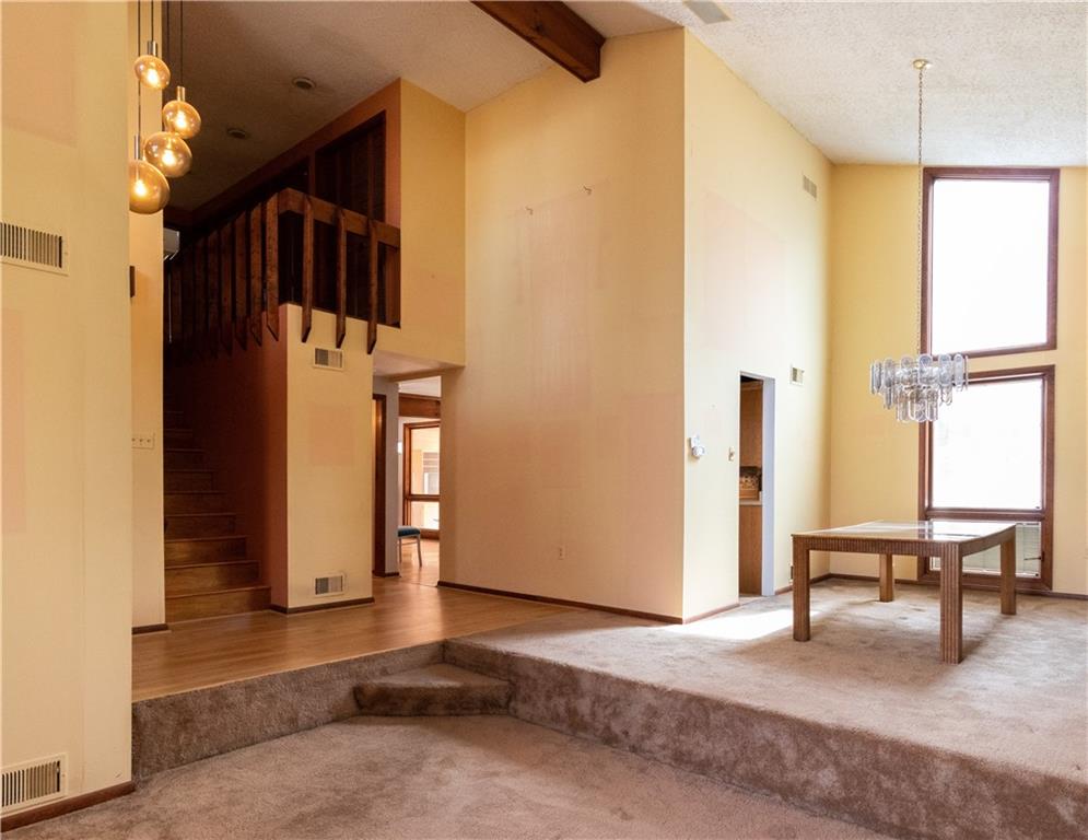 3380 Ridgway Street Pittsburgh, PA 15213 - Photo 7 of 25 Dining room and staircase as viewed from the living room. Kitchen is located to the left of the dining room. Windows look out onto the backyard.