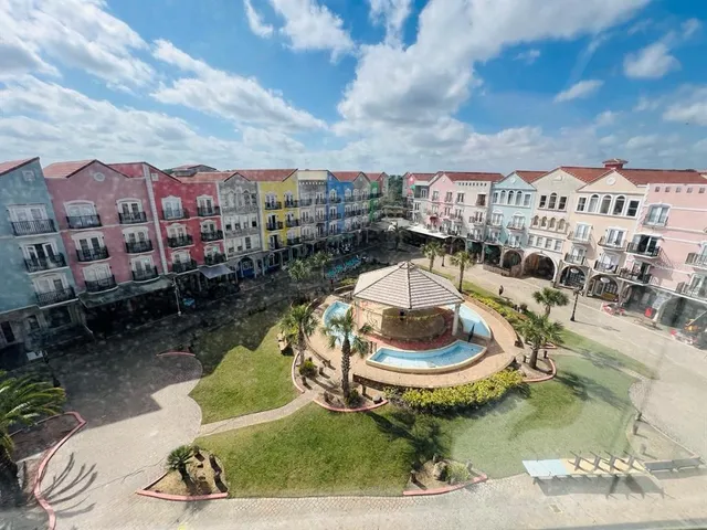 a view of a swimming pool with sitting area