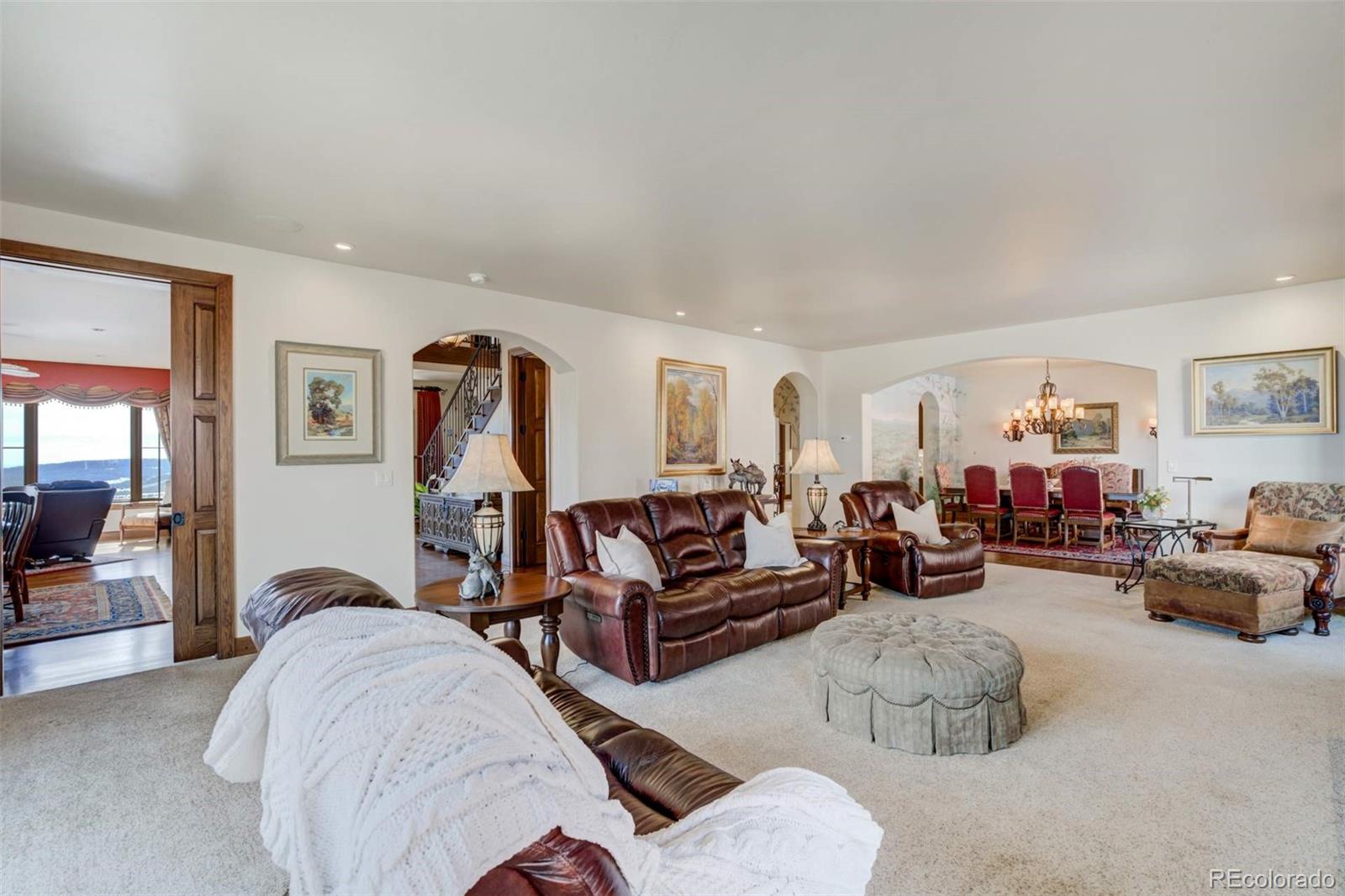 14250 Aiken Ride View Colorado Springs, CO 80926 - Photo 12 of 50 a living room with furniture and a gym