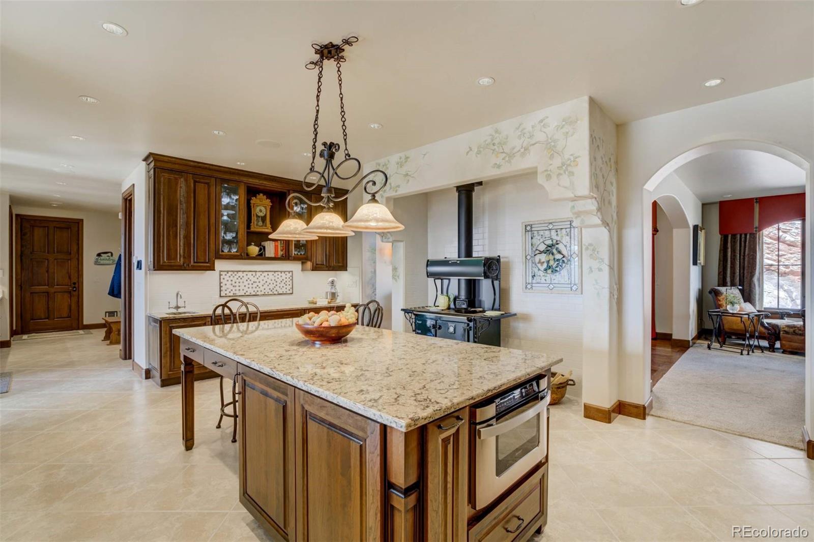 14250 Aiken Ride View Colorado Springs, CO 80926 - Photo 18 of 50 a kitchen that has a lot of cabinets