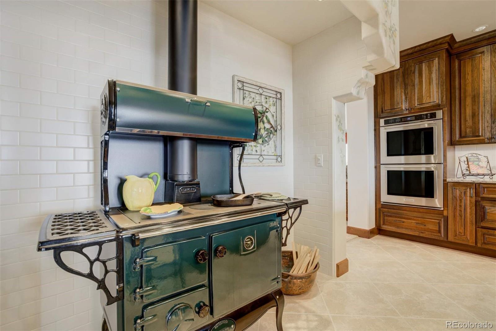 14250 Aiken Ride View Colorado Springs, CO 80926 - Photo 20 of 50 a stove top oven sitting inside of a kitchen