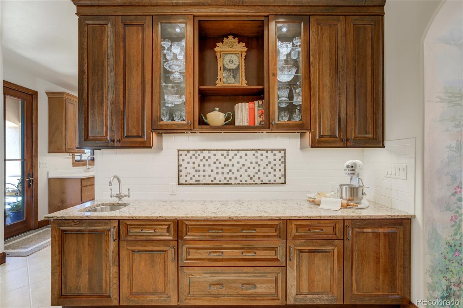 14250 Aiken Ride View Colorado Springs, CO 80926 - Photo 21 of 50 a kitchen with stainless steel appliances granite countertop a sink and cabinets