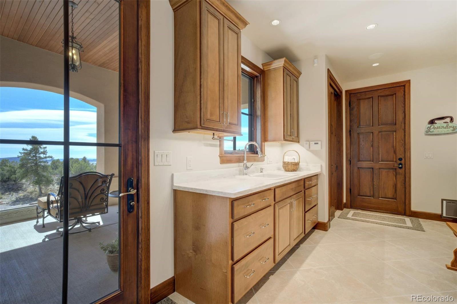 14250 Aiken Ride View Colorado Springs, CO 80926 - Photo 28 of 50 a bathroom with sink shower and mirror