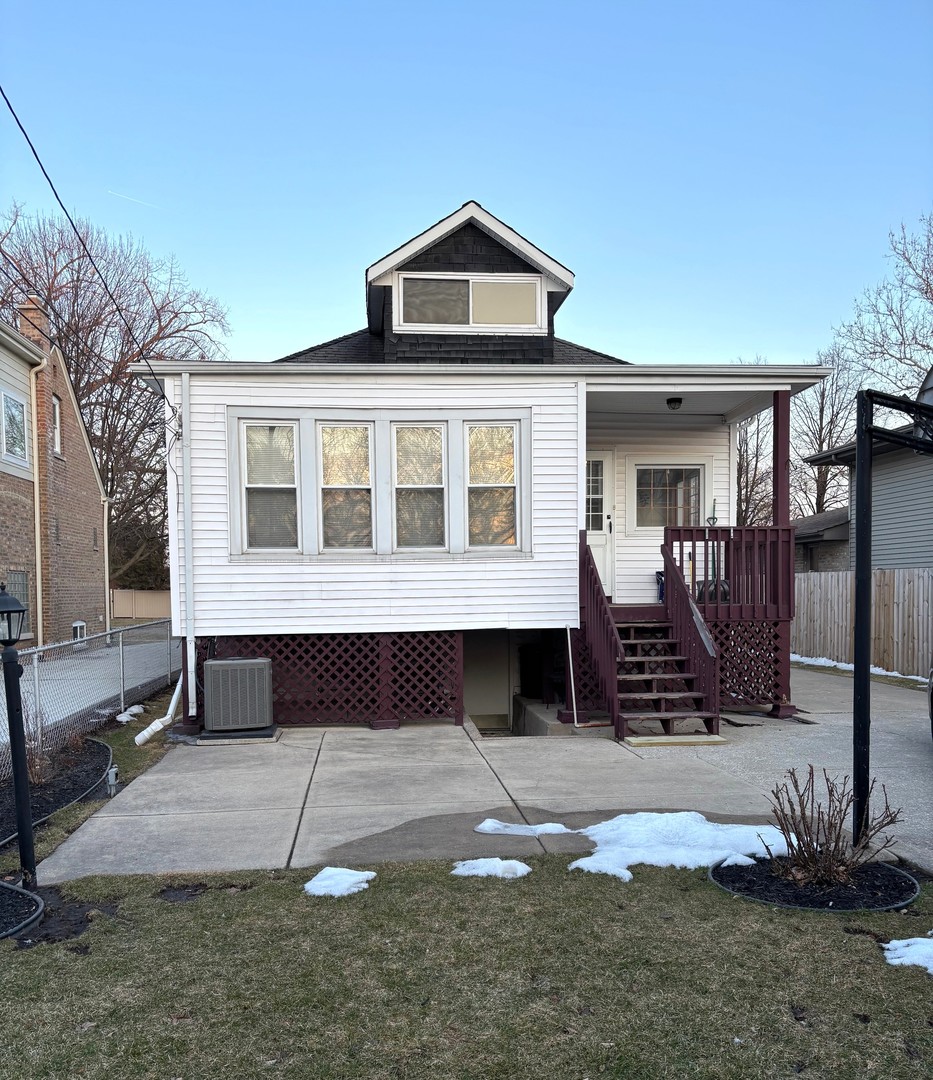 10312 South Spaulding Avenue Chicago, IL 60655 - Photo 2 of 5 a front view of a house with a yard