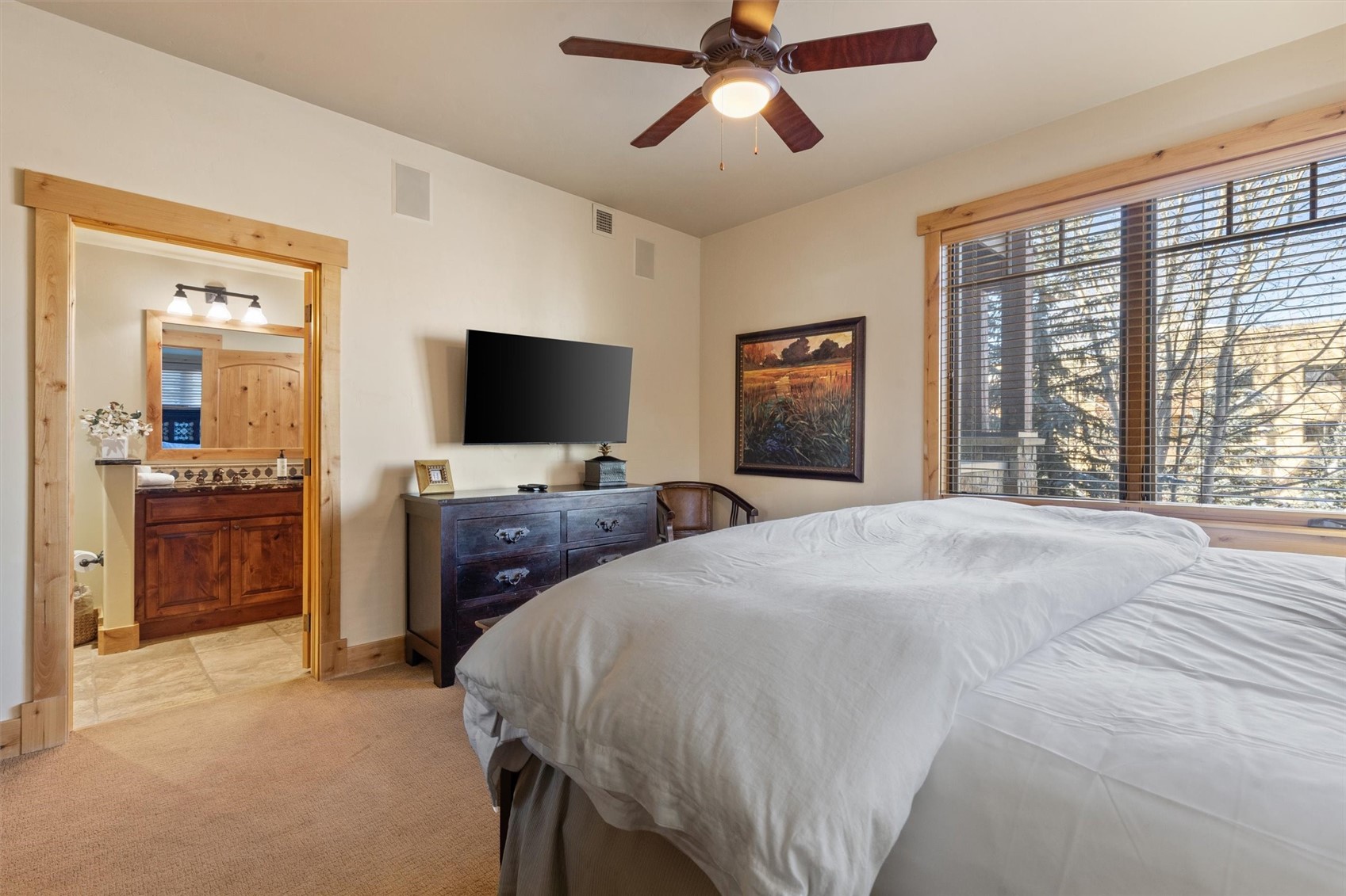 1750 Medicine Springs Road, Unit 6105 Steamboat Springs, CO 80487 - Photo 12 of 43 a bedroom with a bed and a flat screen tv