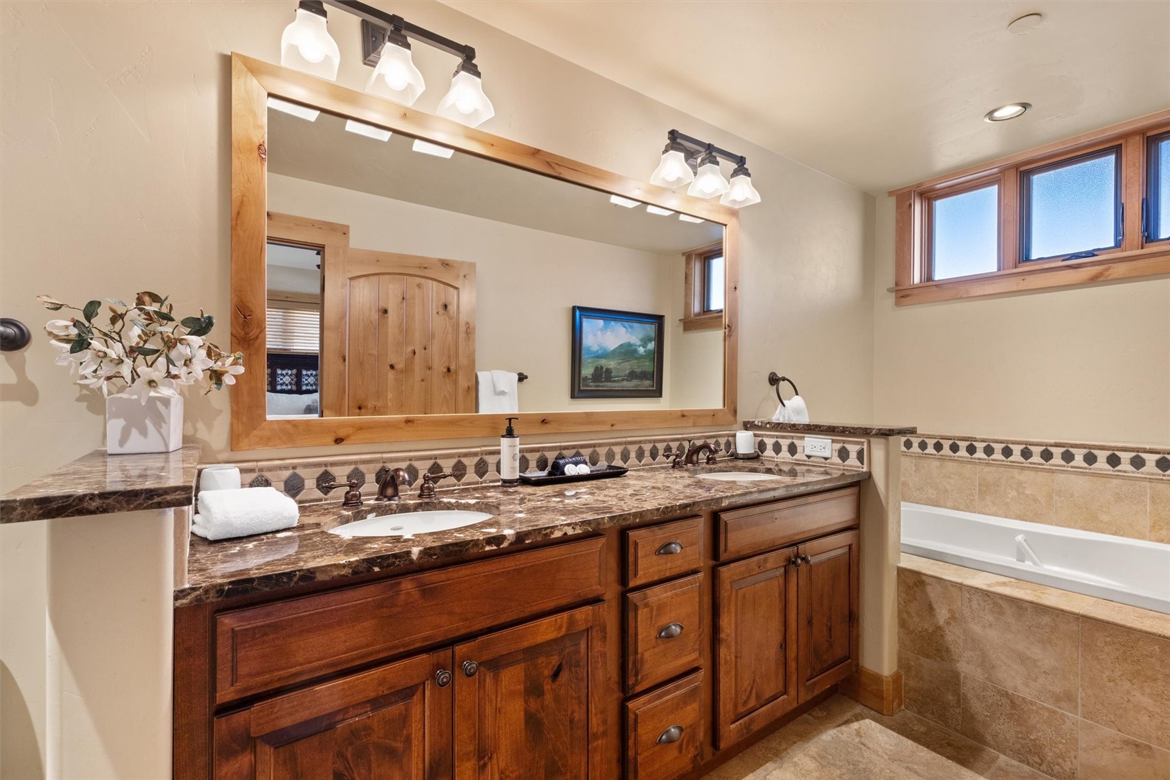 1750 Medicine Springs Road, Unit 6105 Steamboat Springs, CO 80487 - Photo 14 of 43 a bathroom with a sink and a mirror