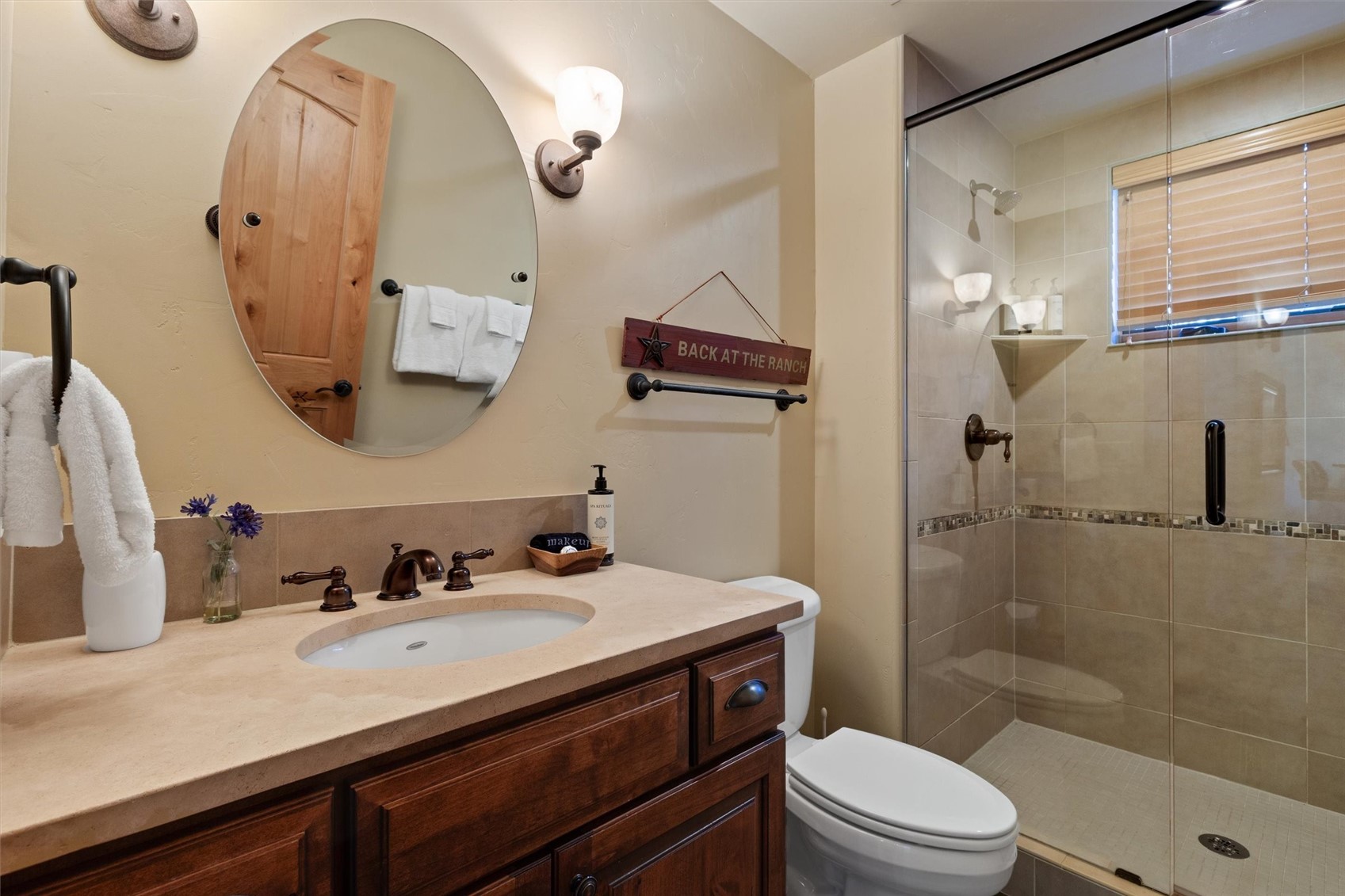 1750 Medicine Springs Road, Unit 6105 Steamboat Springs, CO 80487 - Photo 17 of 43 a bathroom with a sink a toilet and shower