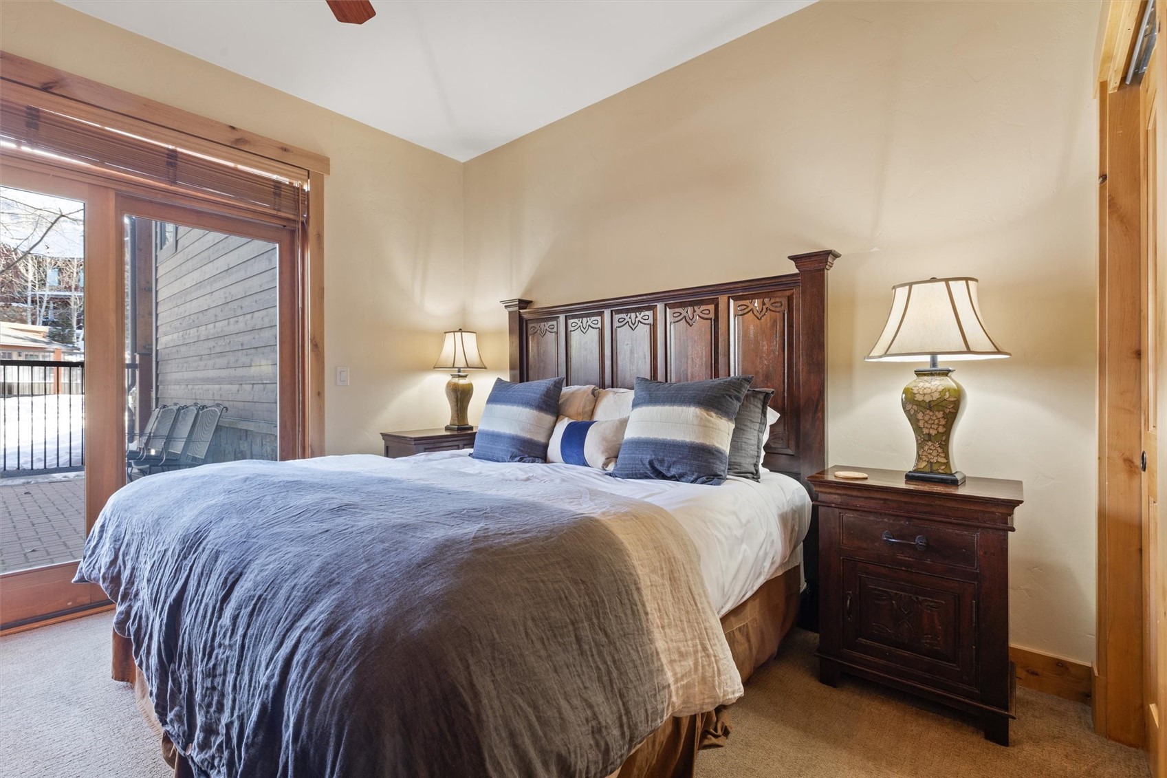 1750 Medicine Springs Road, Unit 6105 Steamboat Springs, CO 80487 - Photo 18 of 43 a bed room with a bed and a night stand