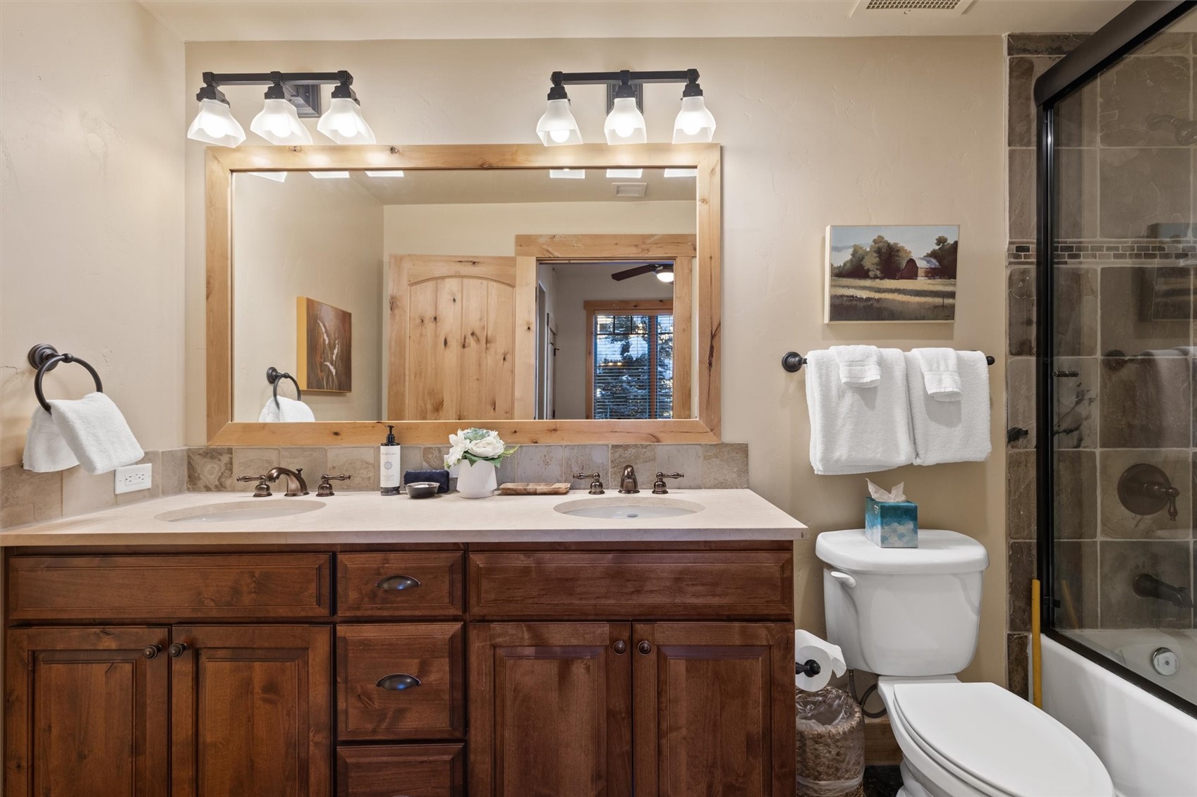 1750 Medicine Springs Road, Unit 6105 Steamboat Springs, CO 80487 - Photo 23 of 43 a bathroom with a toilet sink and mirror
