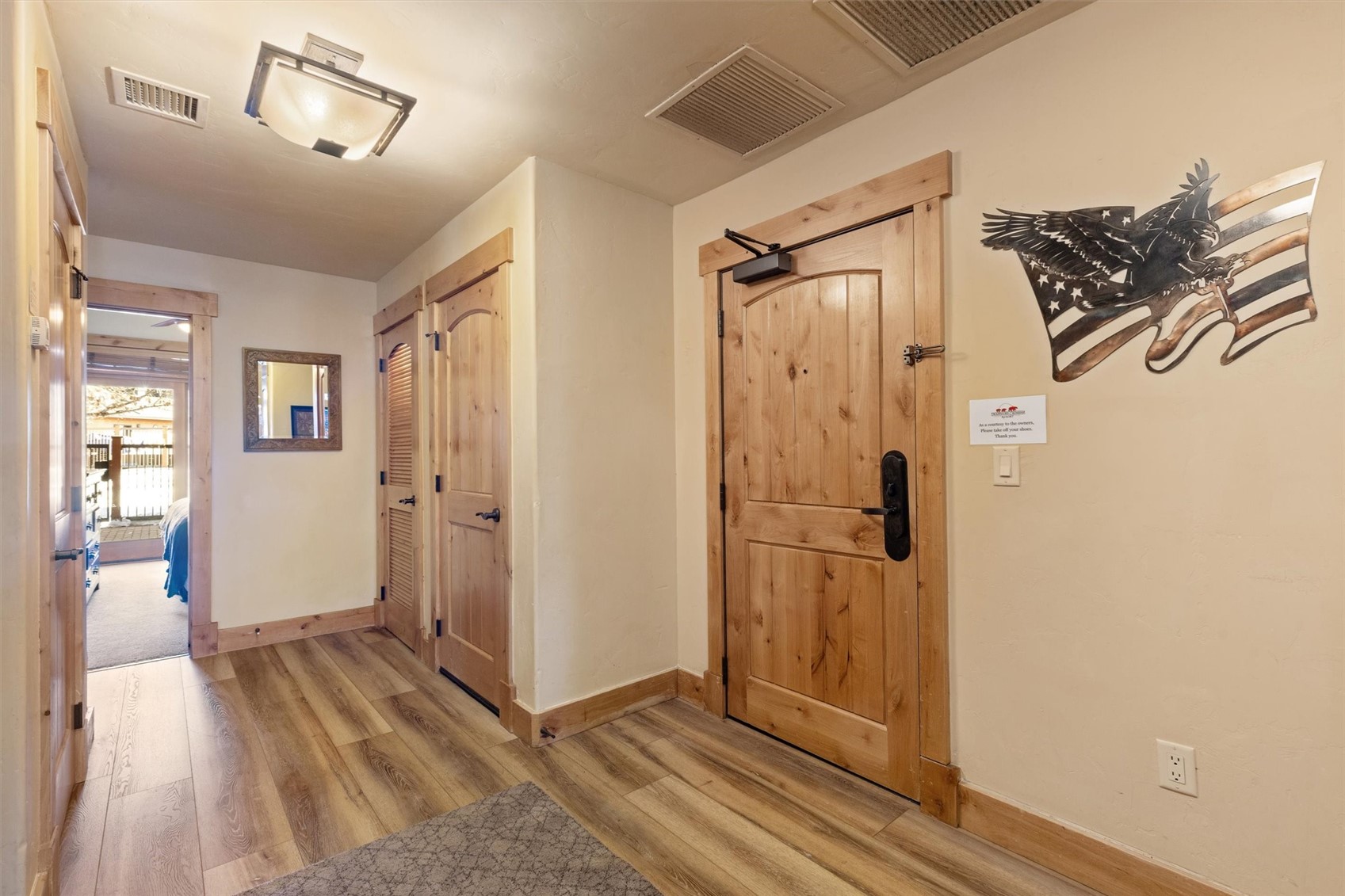 1750 Medicine Springs Road, Unit 6105 Steamboat Springs, CO 80487 - Photo 33 of 43 a view of a hallway with wooden floor and closet