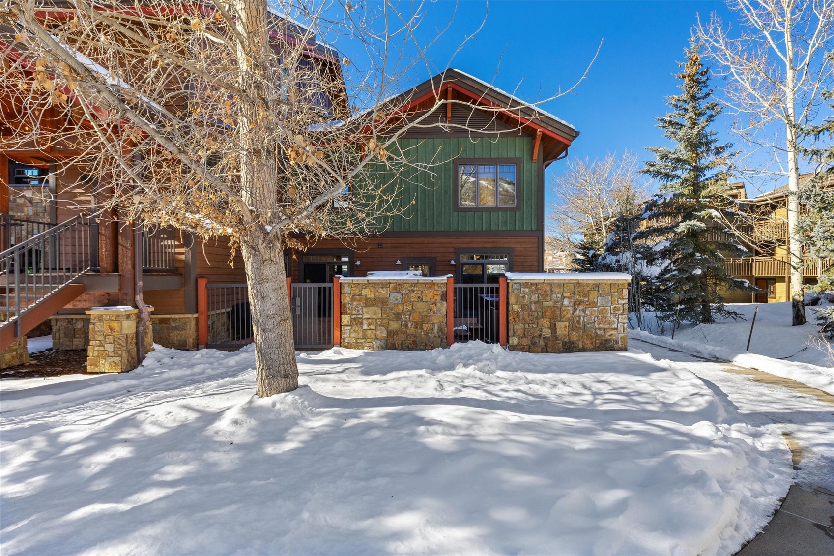 1750 Medicine Springs Road, Unit 6105 Steamboat Springs, CO 80487 - Photo 40 of 43 a view of a house with a yard