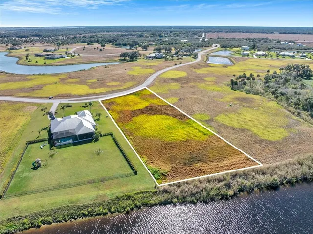 a view of a swimming pool with a table and chairs