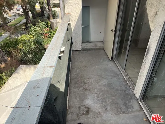 a kitchen with a sink a window and cabinets