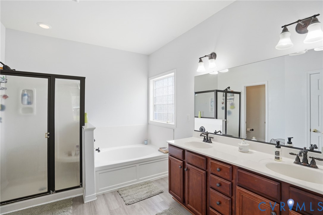 5305 Wellington Ridge Road Richmond, VA 23231 - Photo 35 of 67 Bathroom featuring a dual vanity with dark wood-fi