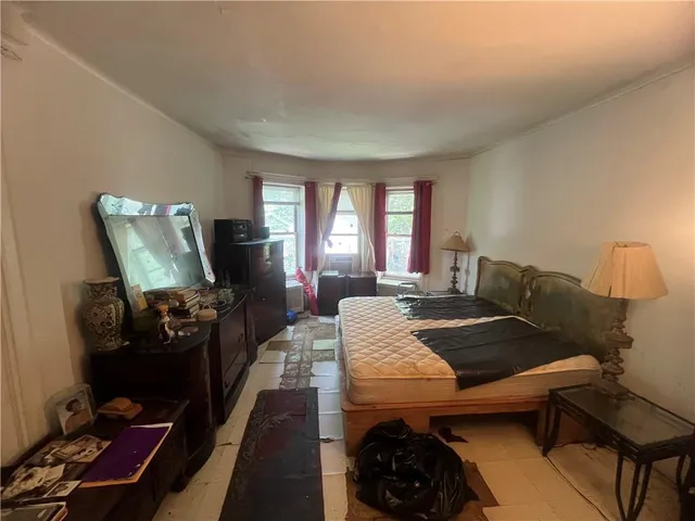 a bed room with furniture and a window