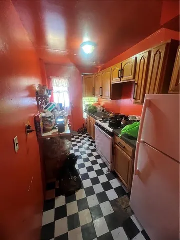 a room with lots of appliances and cabinets