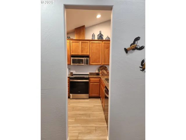 a view of a kitchen from the hallway