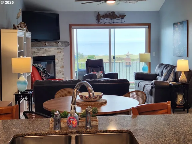 a living room with furniture fireplace and a flat screen tv