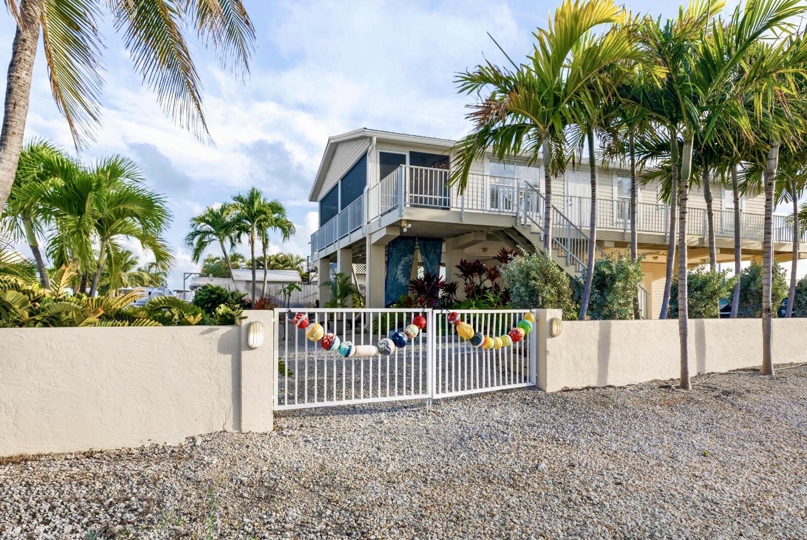 157 Mars Lane Key West, FL 33040 - Photo 4 of 41 a view of street with small garden
