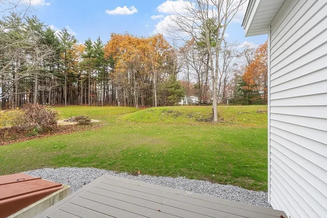 a view of outdoor space with garden and trees