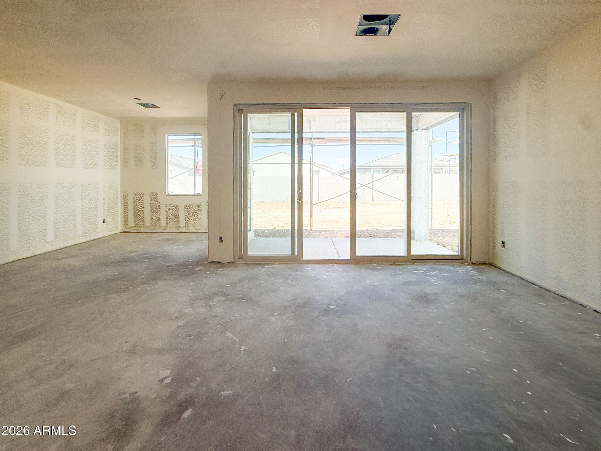 9622 West Gaby Road Tolleson, AZ 85353 - Photo 5 of 13 a view of an empty room with a window