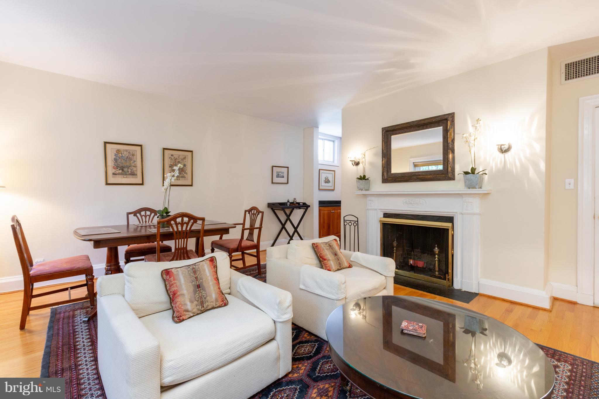 2321 Ashmead Place Northwest Washington, DC 20009 - Photo 14 of 30 Unit 2 Living/Dining Room w/ Woodburning Fireplace