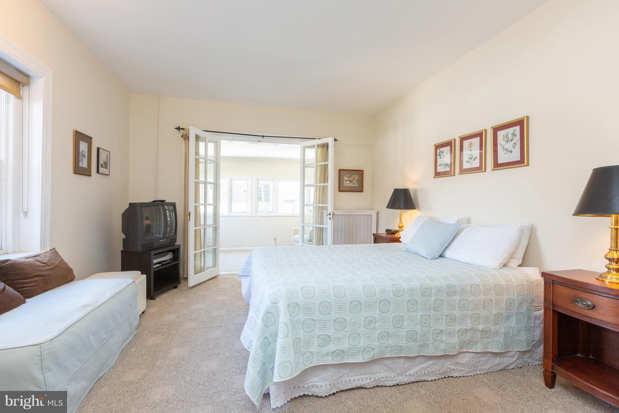 2321 Ashmead Place Northwest Washington, DC 20009 - Photo 19 of 30 Unit 2 Bedroom with French Doors to Sun Room