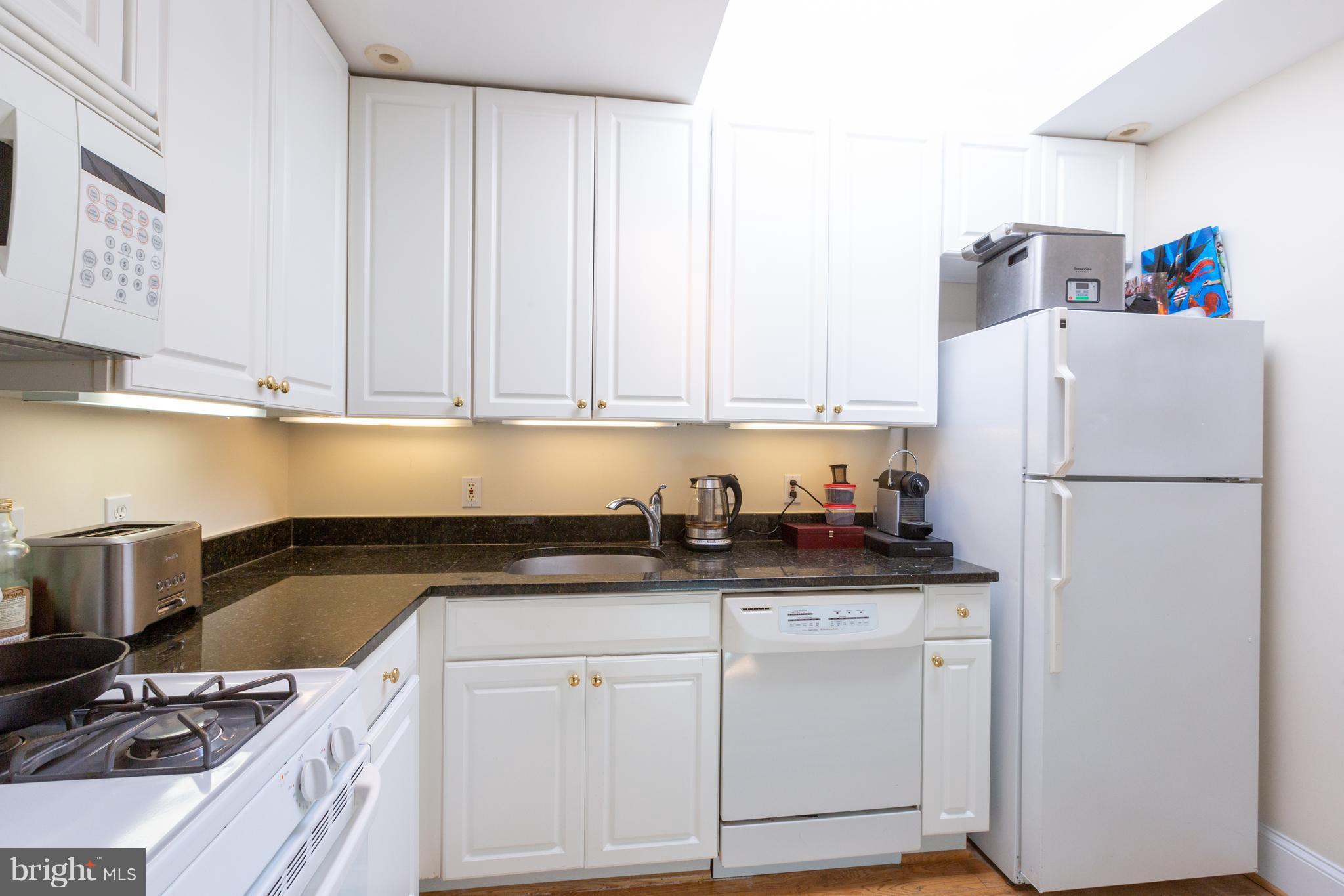2321 Ashmead Place Northwest Washington, DC 20009 - Photo 25 of 30 Unit 3 Kitchen with Granite Counters and Skylight
