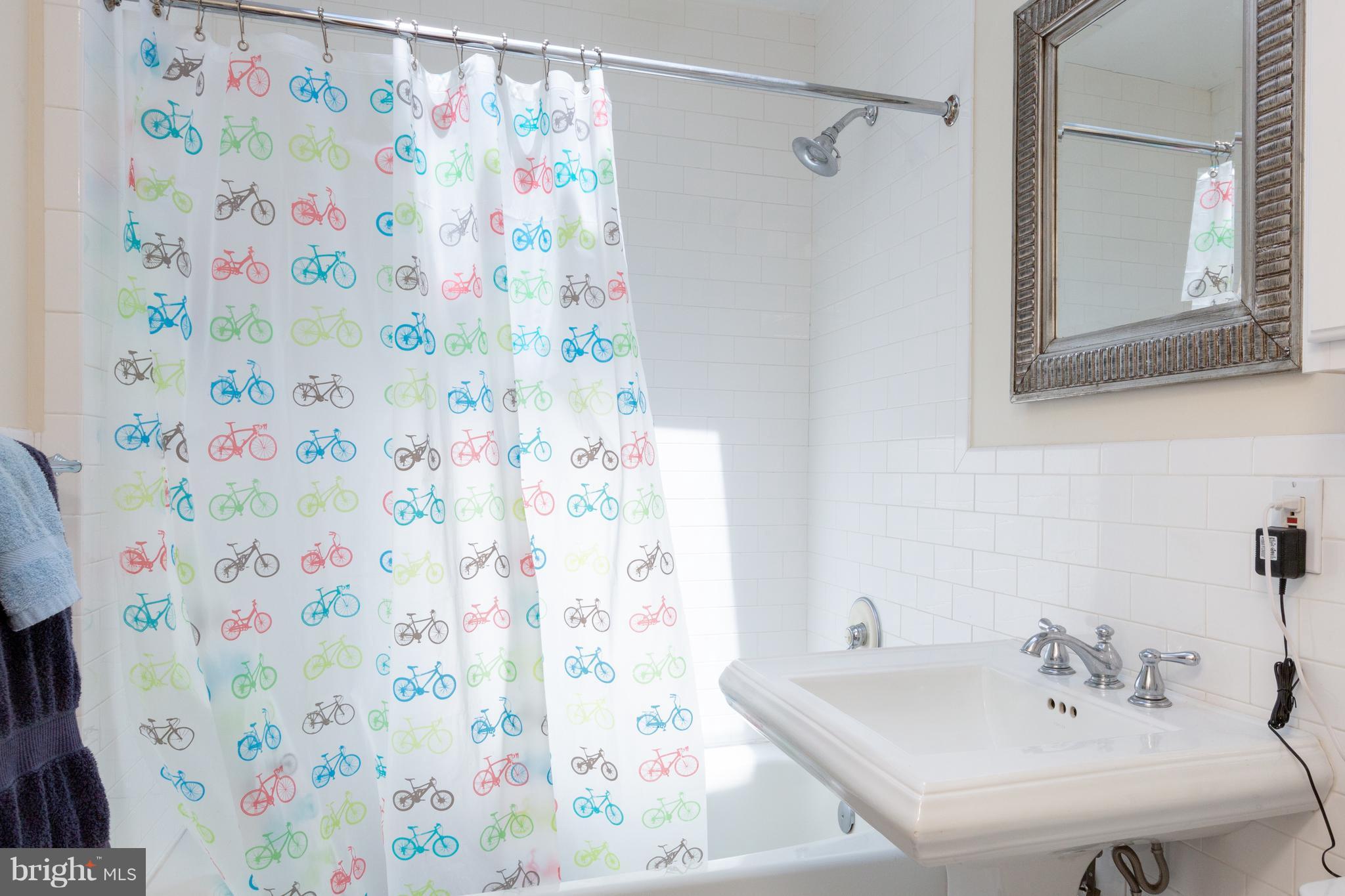 2321 Ashmead Place Northwest Washington, DC 20009 - Photo 26 of 30 Unit 3 Updated Bath with Subway Tiling/ Skylight