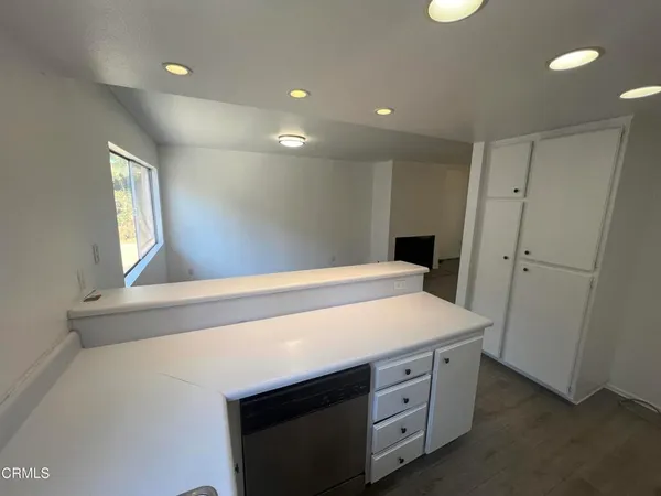 a bathroom with a sink a vanity and a mirror