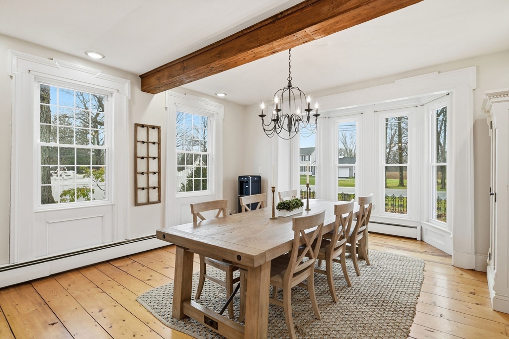 271 North Grand Street Suffield, CT 06093 - Photo 12 of 42 a view of a dining room with furniture window and wooden floor