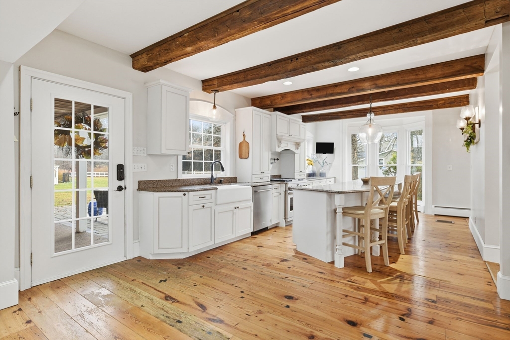 271 North Grand Street Suffield, CT 06093 - Photo 15 of 42 a kitchen with a sink cabinets and wooden floor
