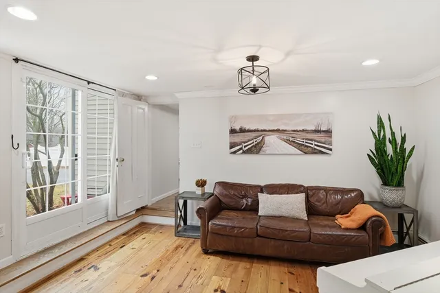 a view of a livingroom with furniture and wooden floor