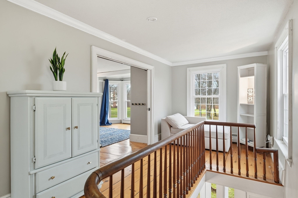 271 North Grand Street Suffield, CT 06093 - Photo 24 of 42 a view of a hallway with wooden floor and windows