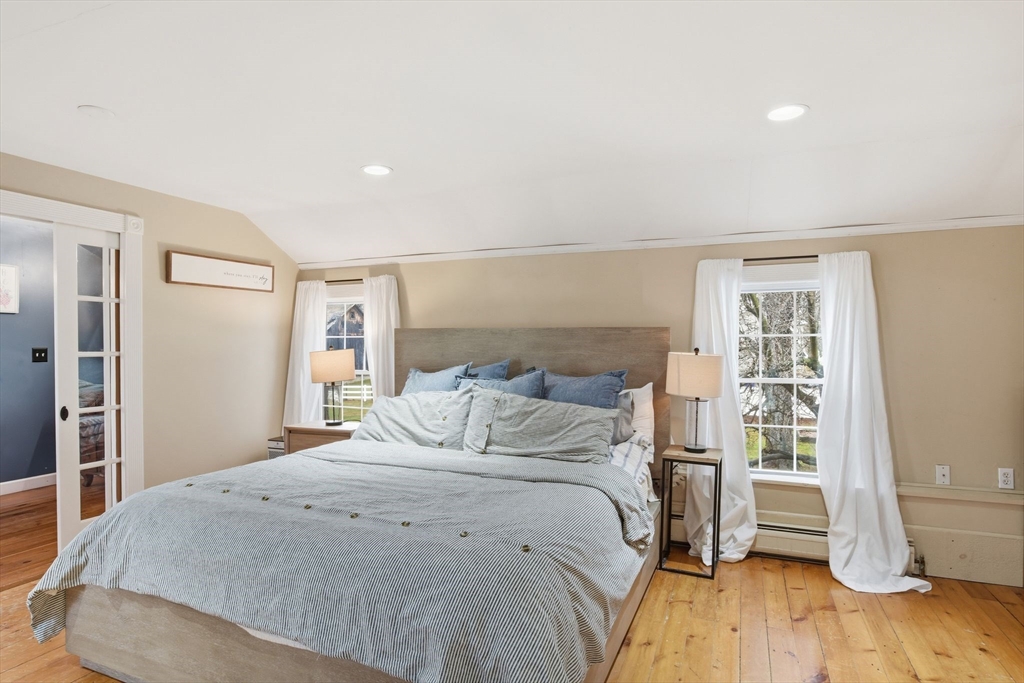 271 North Grand Street Suffield, CT 06093 - Photo 34 of 42 a bedroom with a bed and wooden floor