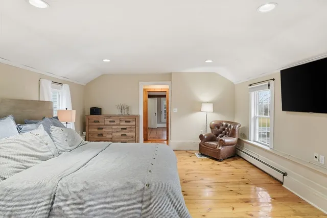 a bedroom with a bed and a flat screen television
