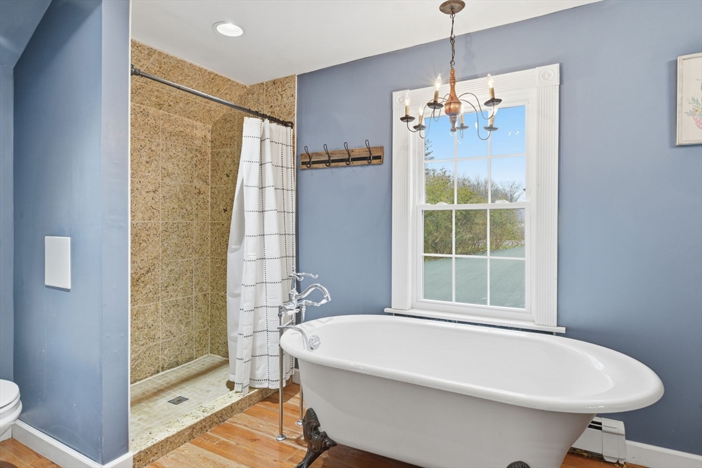 271 North Grand Street Suffield, CT 06093 - Photo 36 of 42 a bathroom with a sink a toilet and shower