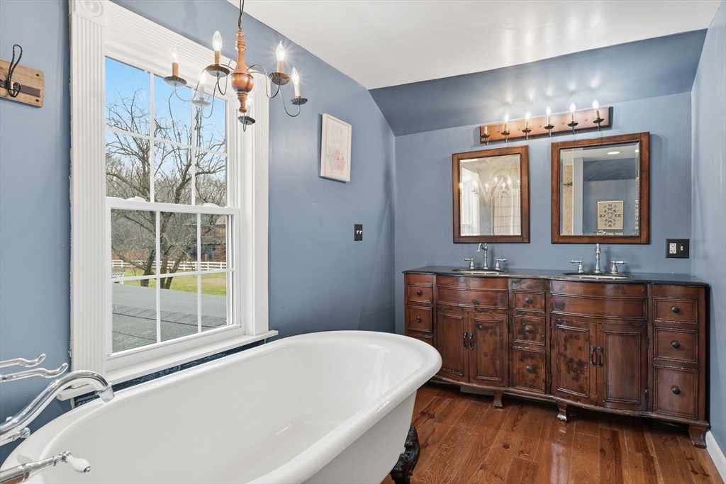 271 North Grand Street Suffield, CT 06093 - Photo 37 of 42 a bathroom with a tub sink and mirror