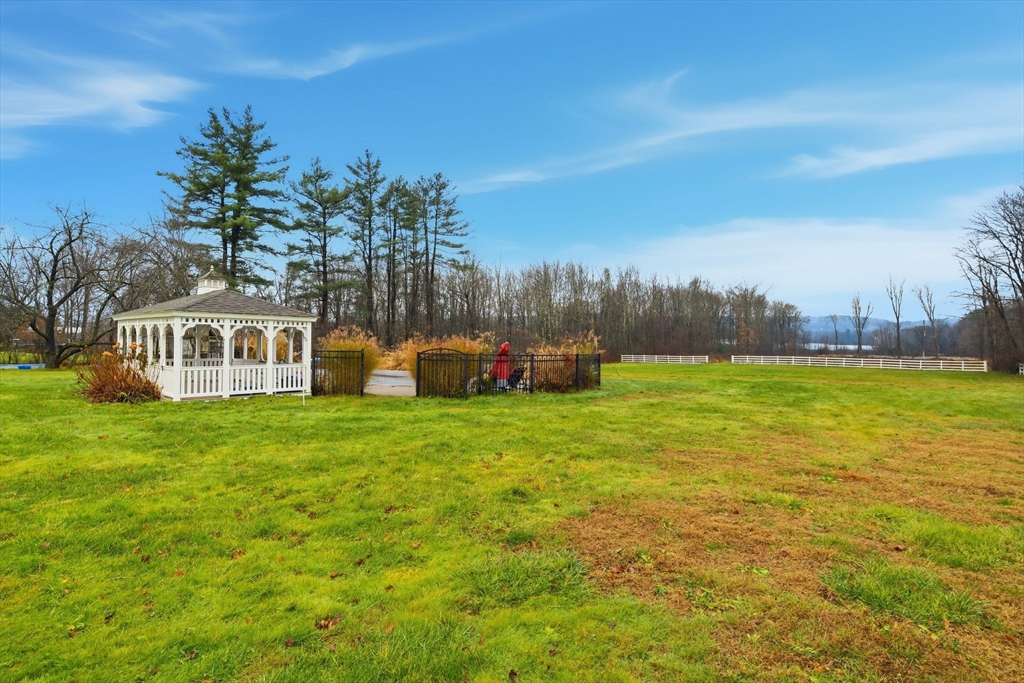 271 North Grand Street Suffield, CT 06093 - Photo 40 of 42 a front view of a house with garden